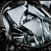 A mirror with the glass broken